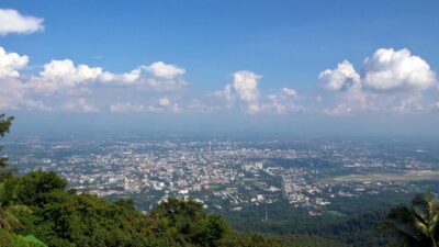 Chiang Mai: Doi Suthep and Hmong Village Half-Day Tour - Wat Phra That Doi Suthep: Steps, Tram, Legends, and City Views