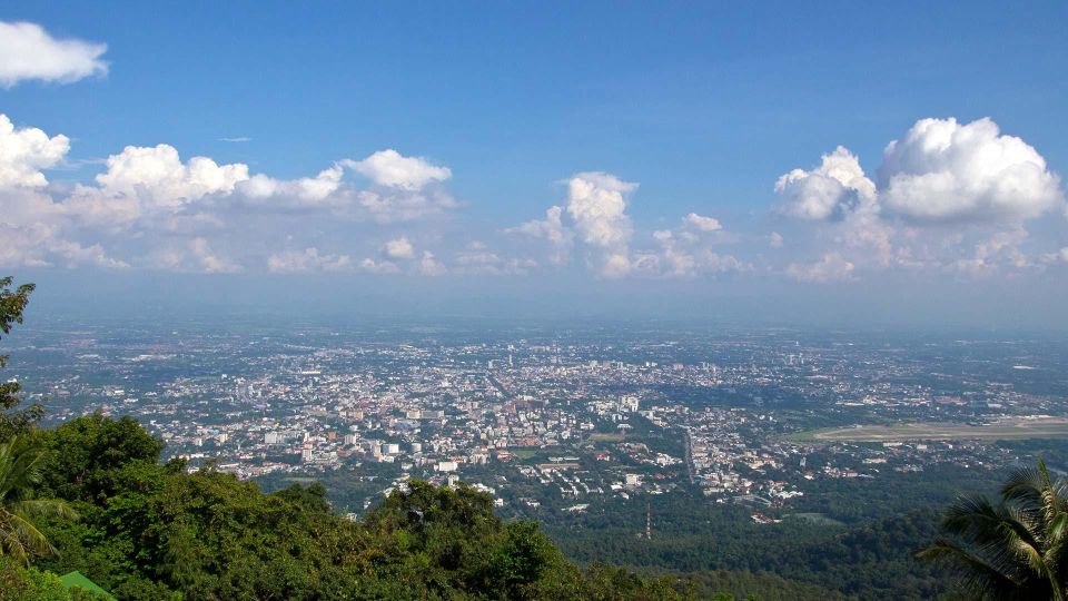 Chiang Mai: Doi Suthep and Hmong Village Half-Day Tour - Wat Phra That Doi Suthep: Steps, Tram, Legends, and City Views