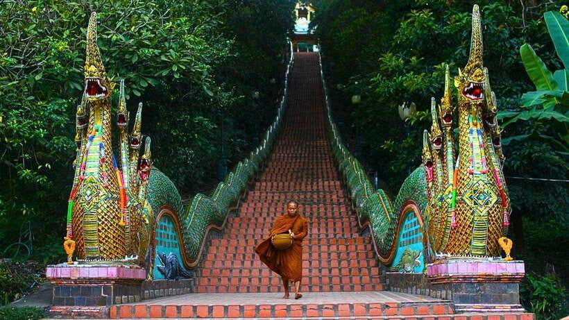 Chiang Mai: Doi Suthep and Wat Pha Lat Temple Evening Tour - Wat Pha Lat at dusk: gardens, statues, and the White and Blue Temple looks